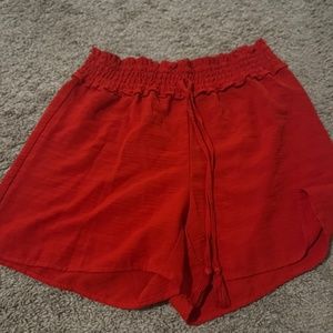 Loose fitting red shorts